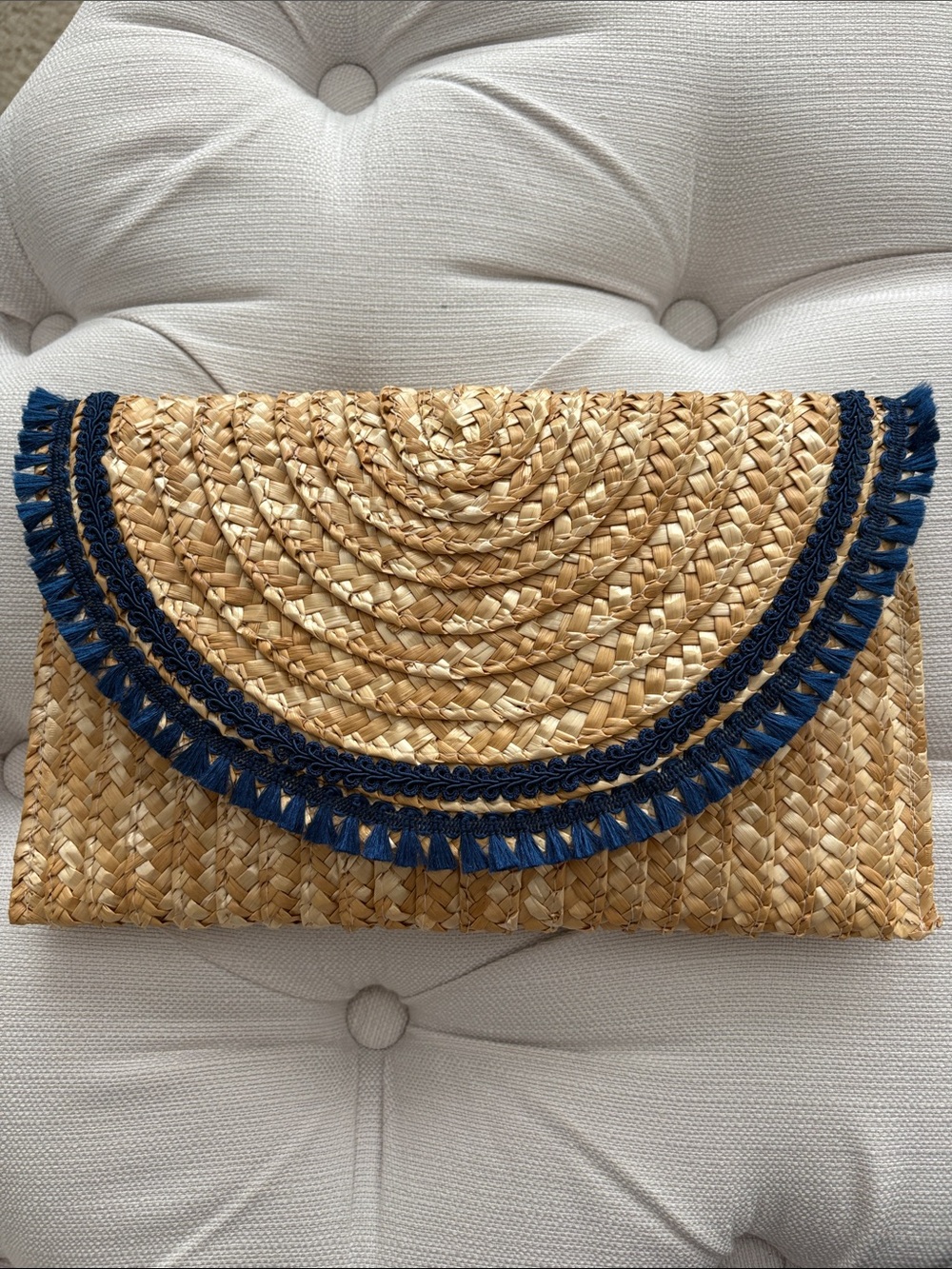 Straw clutch with navy blue trim